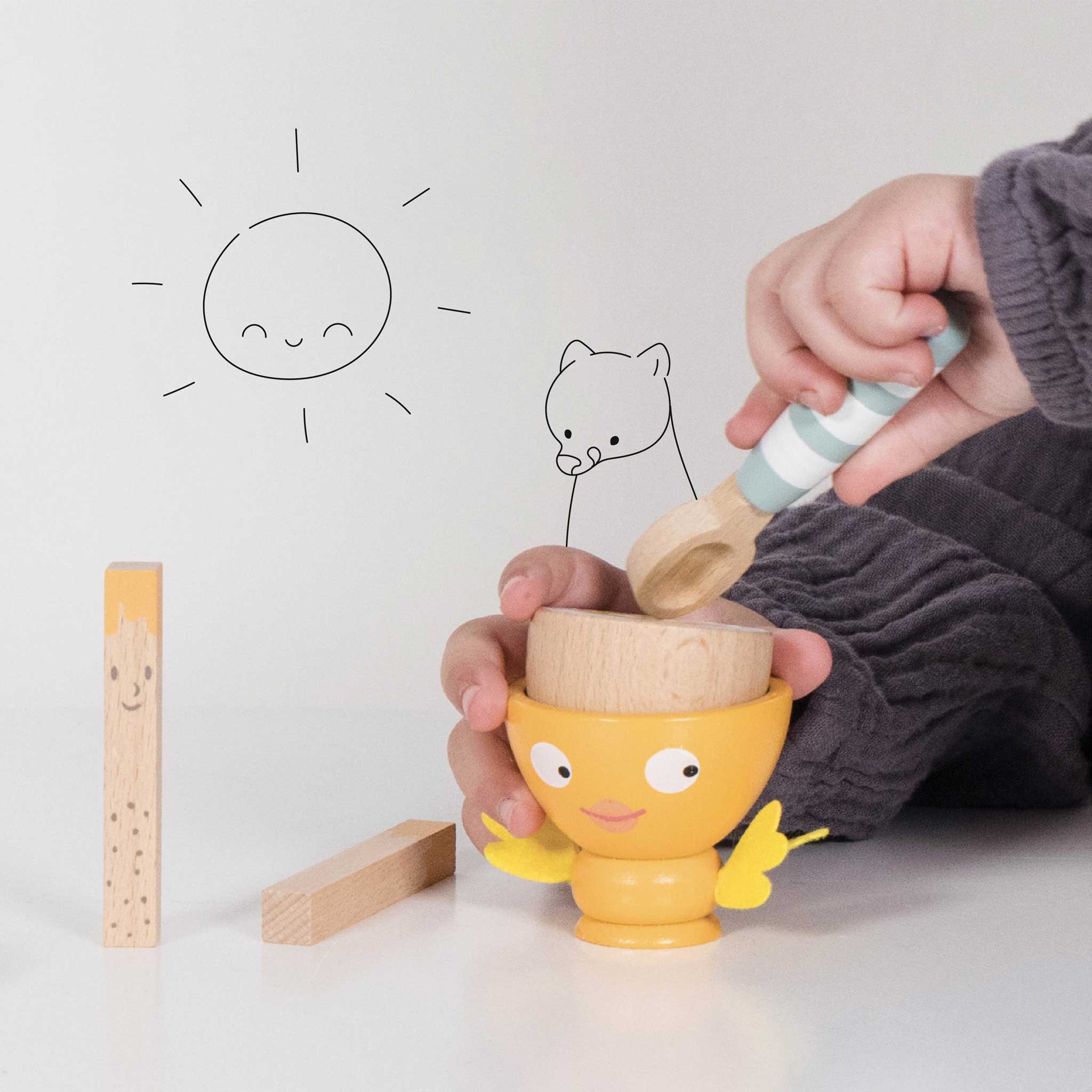 TV315-egg-cup-set-child-pretending-to-eat-with-the-spoon